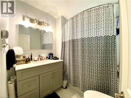 Bathroom featuring a single vanity with a white countertop, under-mount sink, and gray cabinetry - 358 Dundas Street E, Hamilton, ON - Indoor Photo Showing Bathroom