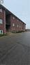 Multi-story brick building featuring multiple white-trimmed windows and individual balconies - 274 E Highland Road E Unit# 10, Kitchener, ON  - Outdoor 