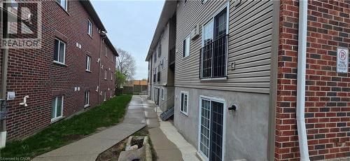 Exterior view featuring brick and horizontal siding facades - 274 E Highland Road E Unit# 10, Kitchener, ON - Outdoor