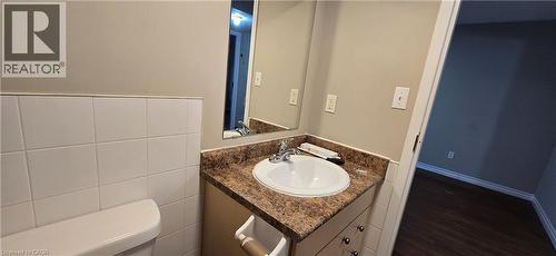 Bathroom vanity with an integrated sink and a patterned countertop - 274 E Highland Road E Unit# 10, Kitchener, ON - Indoor Photo Showing Bathroom