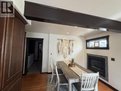 7264 Eugene Road, Prince George, BC - Indoor Photo Showing Dining Room With Fireplace