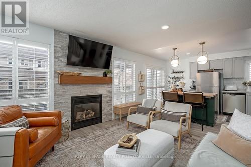 1159 Barclay Circle, Milton, ON - Indoor Photo Showing Living Room With Fireplace