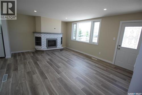 10 Louise Crescent, Katepwa Beach, SK - Indoor Photo Showing Living Room With Fireplace