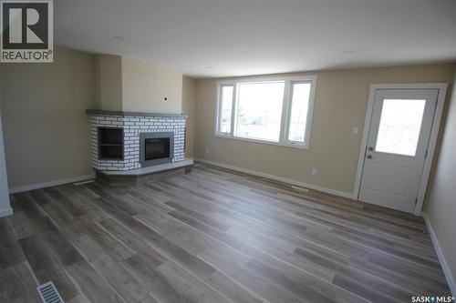 10 Louise Crescent, Katepwa Beach, SK - Indoor Photo Showing Living Room With Fireplace
