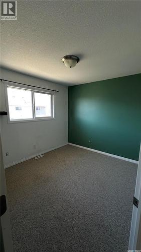 13 1437 1St Street, Estevan, SK - Indoor Photo Showing Other Room