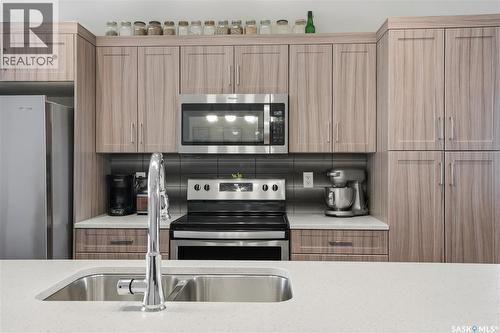 1407 Hughes Drive, Saskatoon, SK - Indoor Photo Showing Kitchen With Double Sink