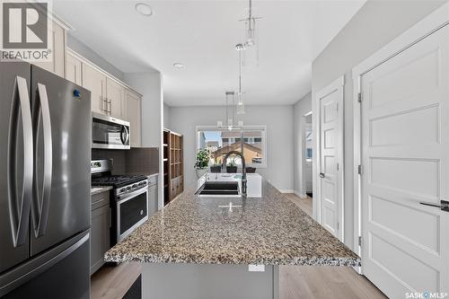 3136 Crosbie Crescent, Regina, SK - Indoor Photo Showing Kitchen With Stainless Steel Kitchen With Double Sink With Upgraded Kitchen
