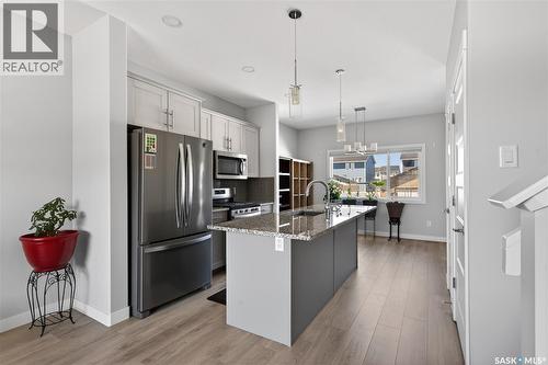 3136 Crosbie Crescent, Regina, SK - Indoor Photo Showing Kitchen With Stainless Steel Kitchen With Double Sink With Upgraded Kitchen
