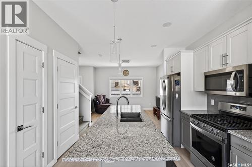 3136 Crosbie Crescent, Regina, SK - Indoor Photo Showing Kitchen With Stainless Steel Kitchen With Double Sink With Upgraded Kitchen