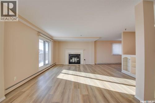 1003 510 5Th Avenue N, Saskatoon, SK - Indoor Photo Showing Living Room With Fireplace