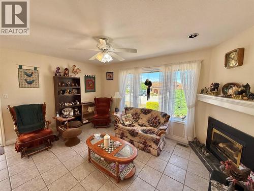 11900 Olympic View, Osoyoos, BC - Indoor Photo Showing Living Room With Fireplace