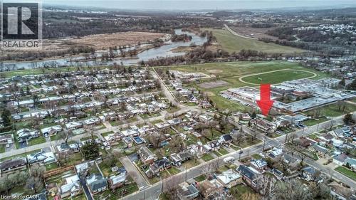 Aerial perspective showcasing a residential neighborhood with a river and natural landscape in the background - 716 Westminster Drive S Unit# Lower, Cambridge, ON - Outdoor With View