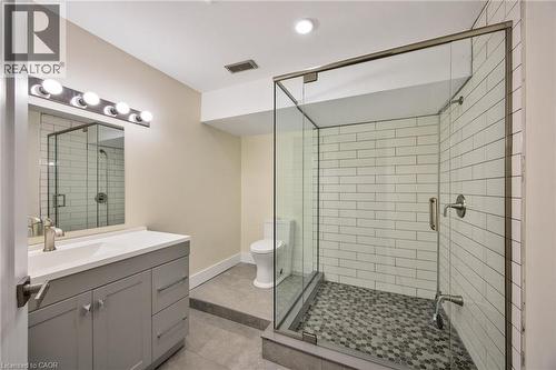Contemporary bathroom featuring a frameless glass shower enclosure with subway tile surround and pebble-style flooring - 6 Dorothys Drive, Oro-Medonte, ON - Indoor Photo Showing Bathroom