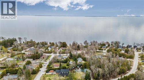 Aerial perspective showcasing a waterfront community with numerous residential properties - 6 Dorothys Drive, Oro-Medonte, ON - Outdoor With View