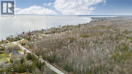 Expansive waterfront property featuring a substantial wooded area, direct water frontage, and surrounding residential properties - 6 Dorothys Drive, Oro-Medonte, ON - Outdoor With Body Of Water With View