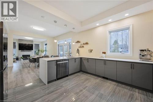 Expansive kitchen featuring wood-finish flooring, recessed lighting, and a large window - 6 Dorothys Drive, Oro-Medonte, ON - Indoor Photo Showing Kitchen