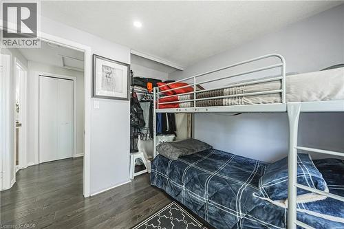 Recessed lighting illuminates a room featuring wood-finish flooring - 235 Larch Street, Hamilton, ON - Indoor Photo Showing Bedroom