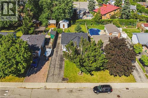 Single-story property featuring a dark-shingled roof and light-colored siding - 235 Larch Street, Hamilton, ON - Outdoor