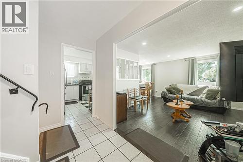 Open concept living area with dark wood-finish flooring - 235 Larch Street, Hamilton, ON - Indoor