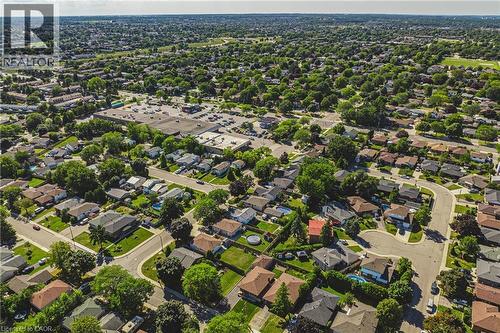 Aerial perspective showcasing residential properties with varied rooflines and established landscaping - 235 Larch Street, Hamilton, ON - Outdoor With View