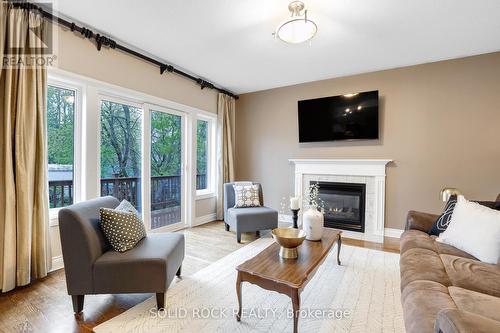 Gas fireplace in the family room - 45 Basswood Avenue, Ottawa, ON - Indoor Photo Showing Living Room With Fireplace