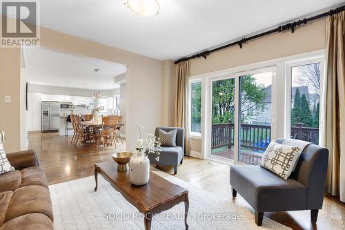 Family room open to dining room and kitchen - 45 Basswood Avenue, Ottawa, ON - Indoor Photo Showing Living Room