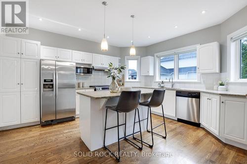 Kitchen with hardwood floors and granite counterto - 45 Basswood Avenue, Ottawa, ON - Indoor Photo Showing Kitchen With Upgraded Kitchen
