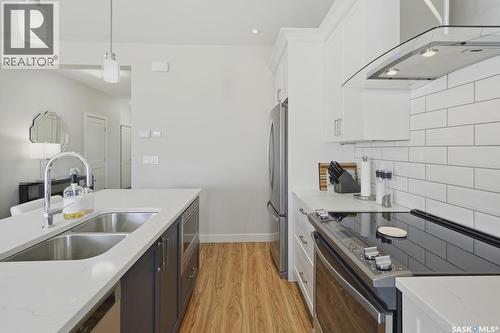 27 619 Evergreen Boulevard, Saskatoon, SK - Indoor Photo Showing Kitchen With Double Sink With Upgraded Kitchen