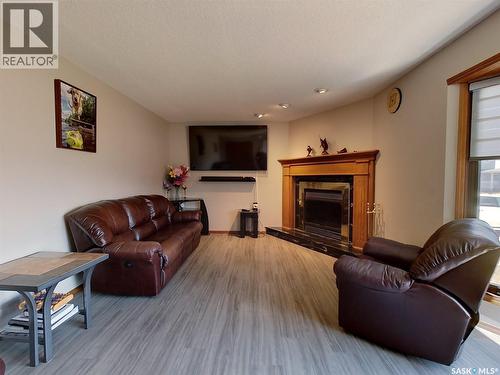 334 Young Street, Earl Grey, SK - Indoor Photo Showing Living Room With Fireplace