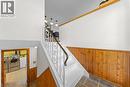 Staircase featuring white risers and treads, decorative wrought iron railing, and a wood-finish handrail - 183 Harvard Road, Waterloo, ON  - Indoor Photo Showing Other Room 