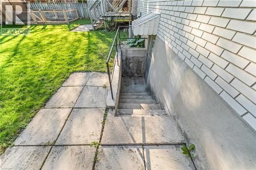 Concrete basement stairwell with metal handrail - 183 Harvard Road, Waterloo, ON - Outdoor