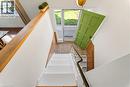 Entryway featuring a vibrant green paneled door, sidelight windows, and tiled flooring - 183 Harvard Road, Waterloo, ON  - Indoor Photo Showing Other Room 