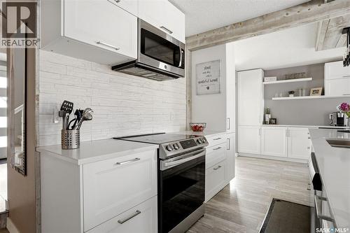6954 Maple Brook Crescent, Regina, SK - Indoor Photo Showing Kitchen With Double Sink