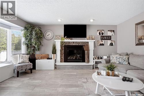 6954 Maple Brook Crescent, Regina, SK - Indoor Photo Showing Living Room With Fireplace