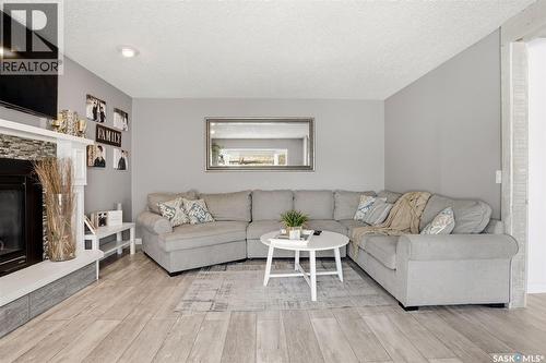 6954 Maple Brook Crescent, Regina, SK - Indoor Photo Showing Living Room With Fireplace