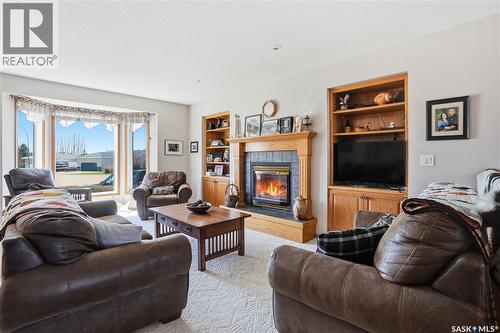 403 Willow Bay, Balgonie, SK - Indoor Photo Showing Living Room With Fireplace