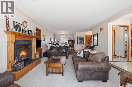 403 Willow Bay, Balgonie, SK - Indoor Photo Showing Living Room With Fireplace
