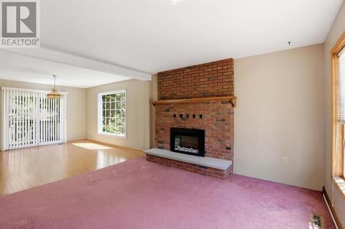 4562 Second Lin W, Prince Township, ON - Indoor Photo Showing Living Room With Fireplace