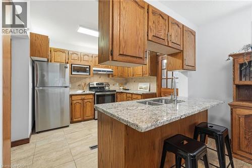 507 Queensdale Avenue E, Hamilton, ON - Indoor Photo Showing Kitchen With Double Sink