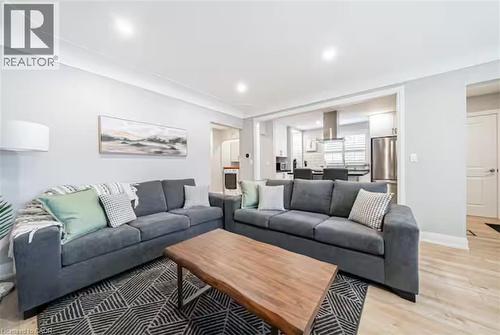 Living area featuring recessed lighting, light-toned walls, and wood-finish flooring - 88 South Bend Road E Unit# Unit A, Hamilton, ON - Indoor Photo Showing Living Room