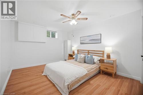 Room featuring wood-finish flooring and a ceiling fan with light fixture - 1376 Royal Drive, Burlington, ON - Indoor Photo Showing Bedroom