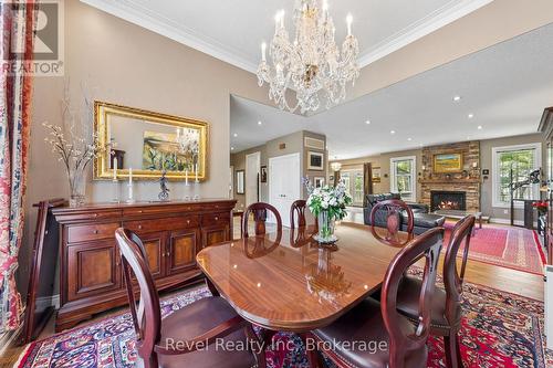 54 Vincent Circle, Tiny, ON - Indoor Photo Showing Dining Room With Fireplace