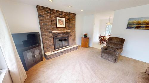 3109 Mt Royal Drive, Cranbrook, BC - Indoor Photo Showing Living Room With Fireplace