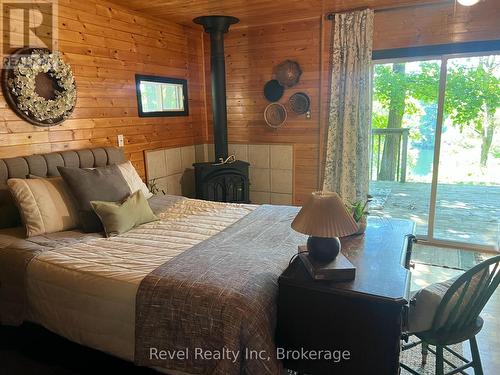 lower Level primary with walkout - 14 Swallow Road, Mcdougall, ON - Indoor Photo Showing Bedroom