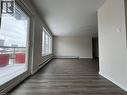 Spacious interior featuring wood-finish flooring and white baseboards - 232 Louisa Street Unit# 9A, Kitchener, ON  - Indoor Photo Showing Other Room 