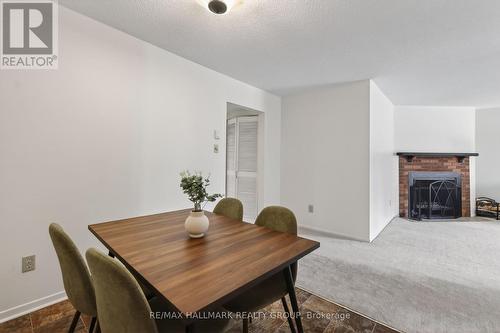 33 Haxby Private, Ottawa, ON - Indoor Photo Showing Dining Room With Fireplace