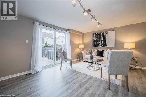 Living area featuring wood-finish flooring and neutral wall tones - 27 Max Becker Drive, Kitchener, ON - Indoor Photo Showing Living Room
