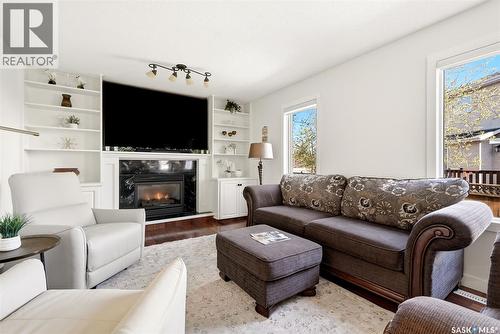 3234 Peyson Bay E, Regina, SK - Indoor Photo Showing Living Room With Fireplace