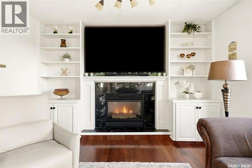 3234 Peyson Bay E, Regina, SK - Indoor Photo Showing Living Room With Fireplace