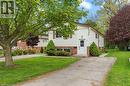 Split-level residence featuring white siding and brick detailing - 9 Cherry Street, Simcoe, ON  - Outdoor 